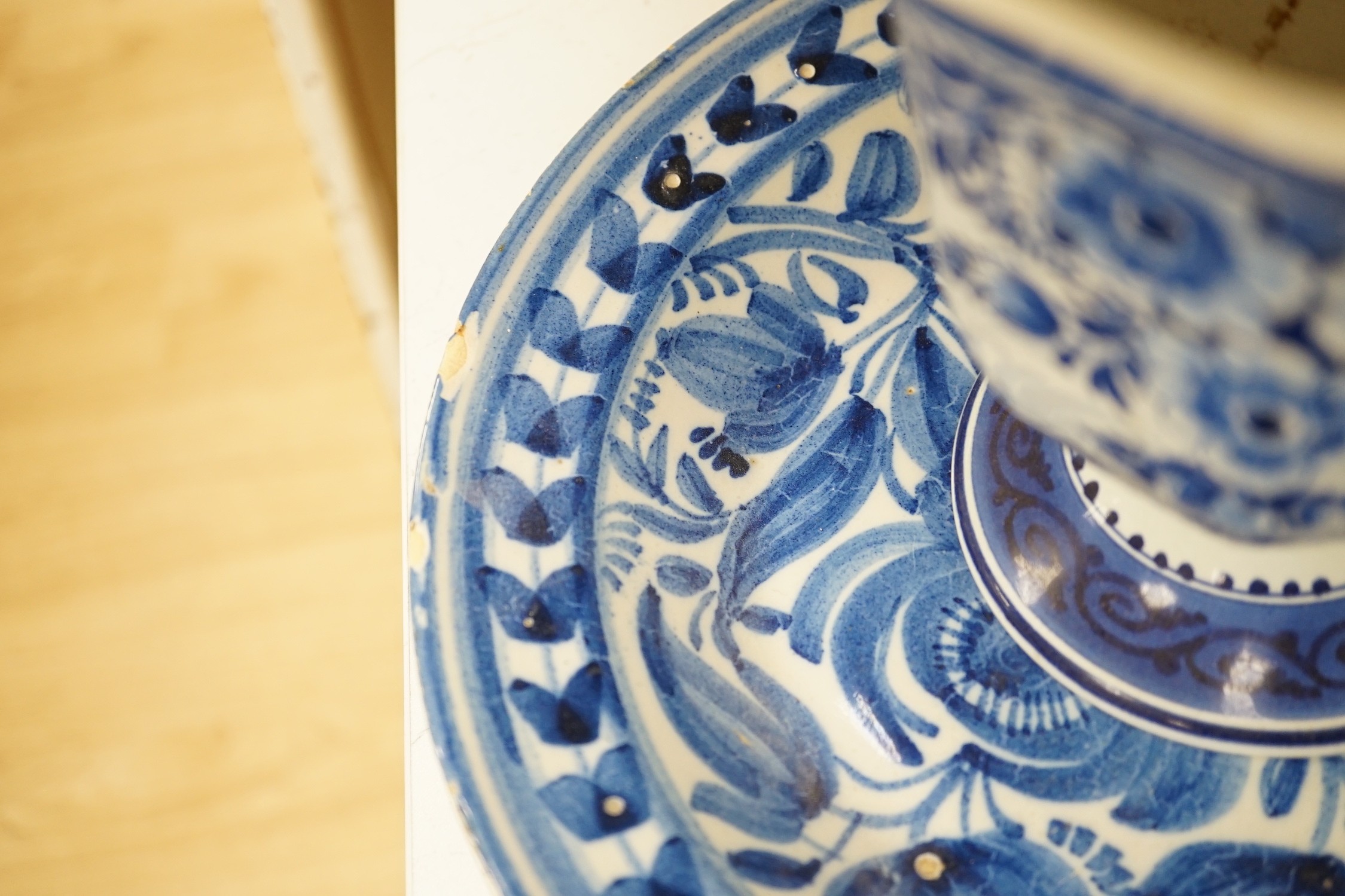 An assortment of Chinese porcelain tin-glazed earthenware charger and a Delft vase